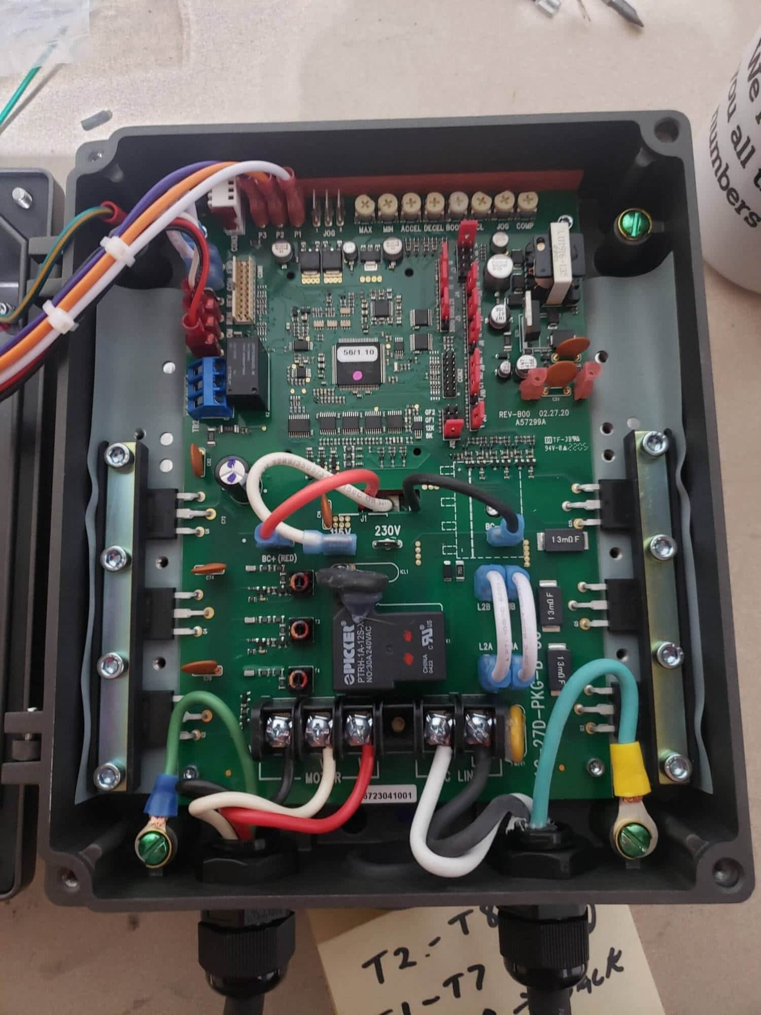 An open KBAC-27D drive enclosure showing the circuit board and wiring