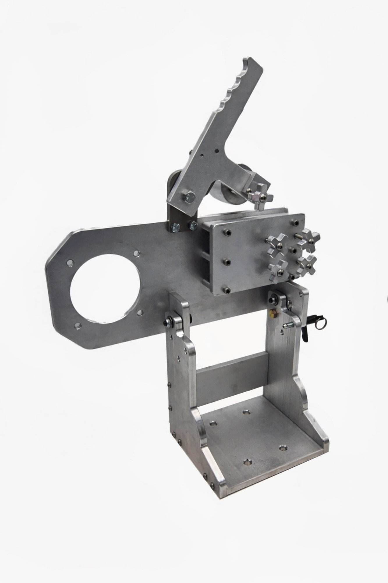 Aluminum tool arm assembly photographed from the opposite side showing safety warning stickers