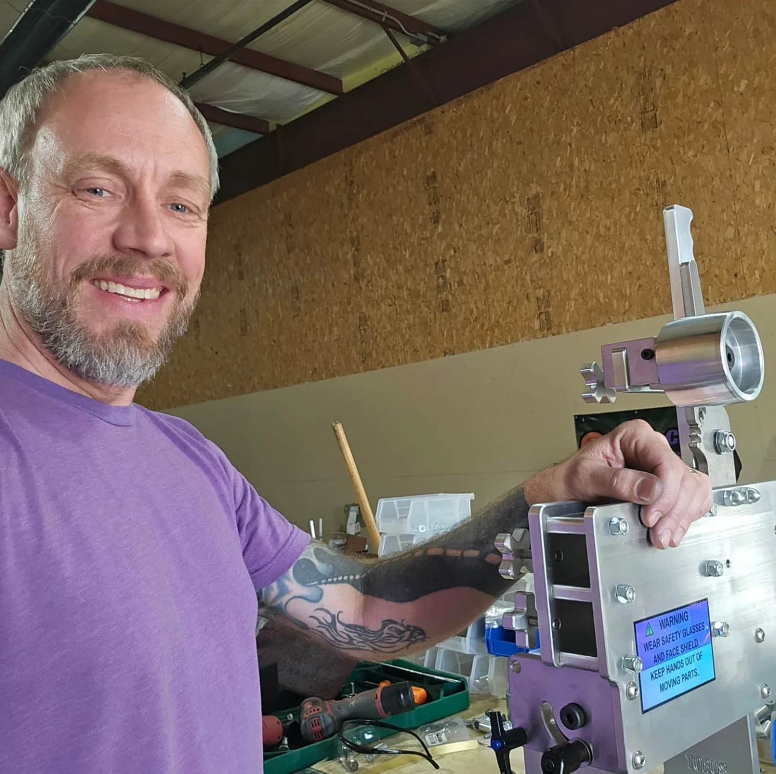 Rich Linville in the Torus CNC shop with a finished 2x72 belt grinder