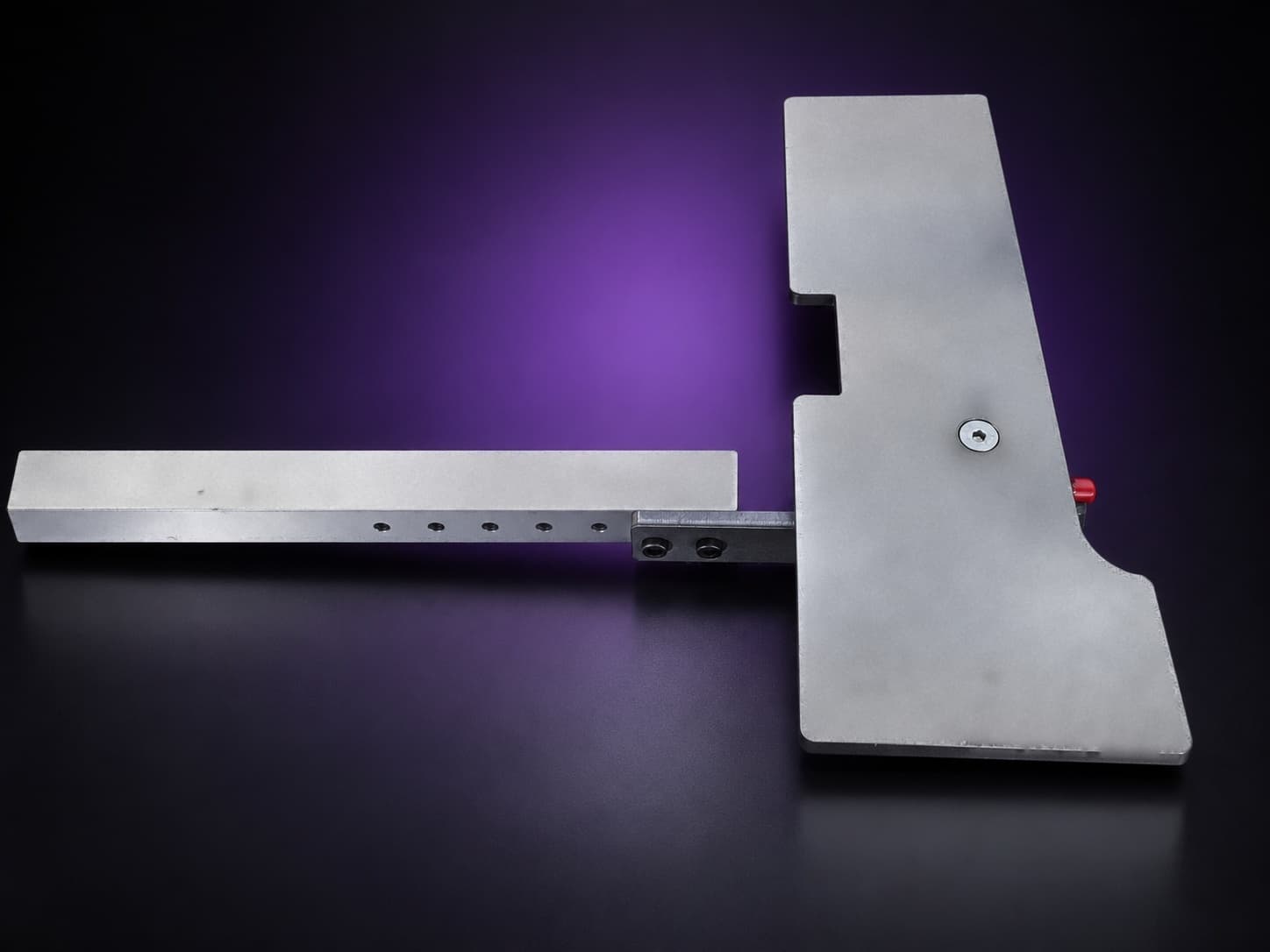 Steel work table plate on its drilled square aluminum arm bar, seen from above, on black with a purple glow