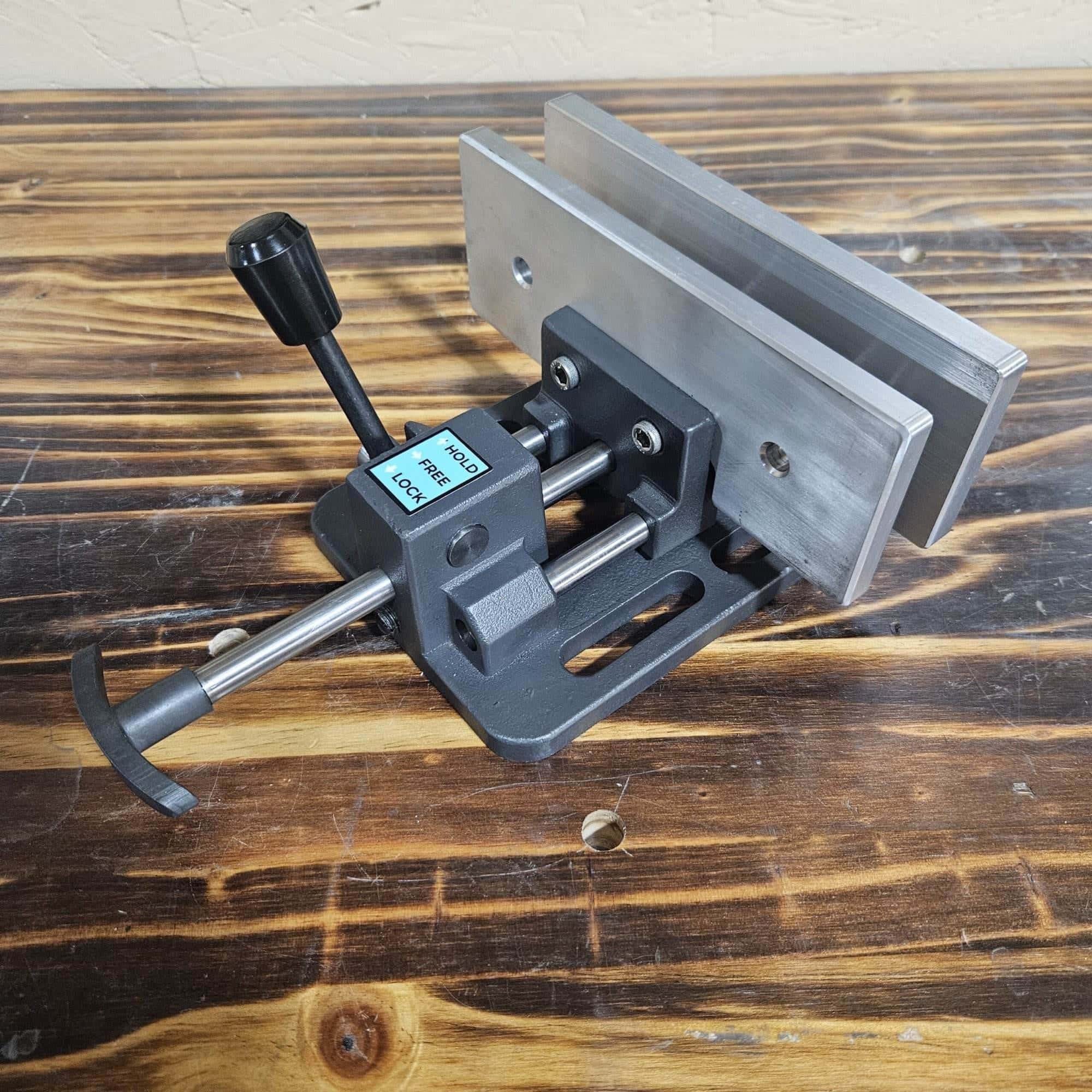 Angled view of the Torus CNC quick quench vise showing its cast jaws and locking lever