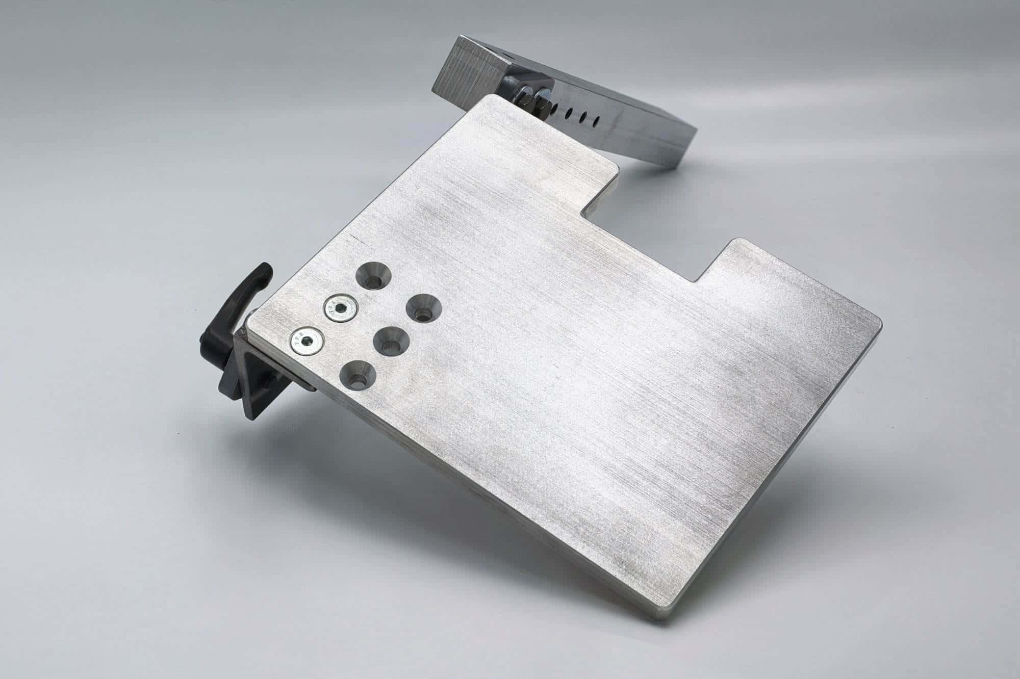 U-shaped aluminum drive wheel bracket with rubber bushings on each arm mounted to a square bar