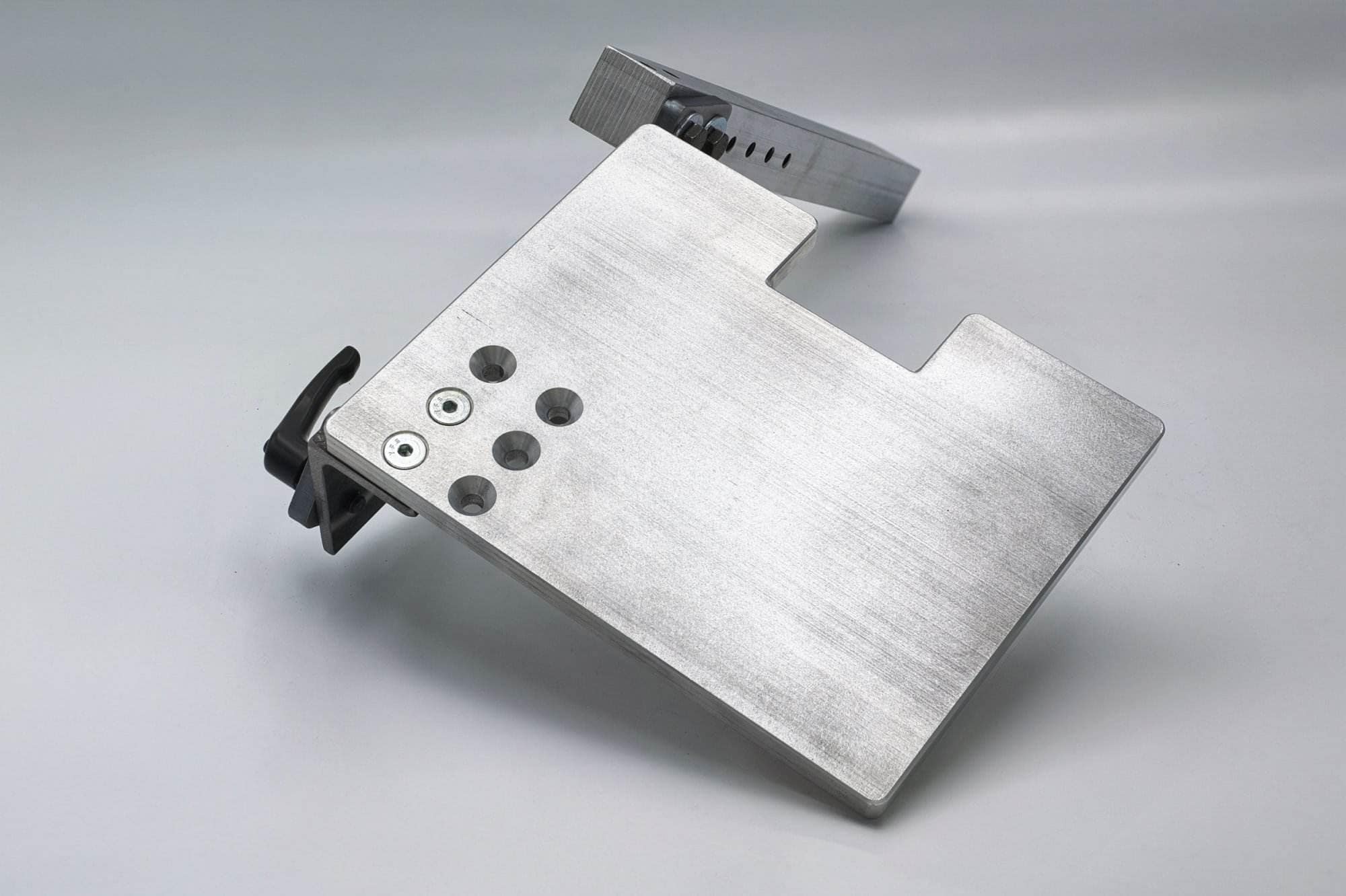 U-shaped aluminum drive wheel bracket with rubber bushings on each arm mounted to a square bar