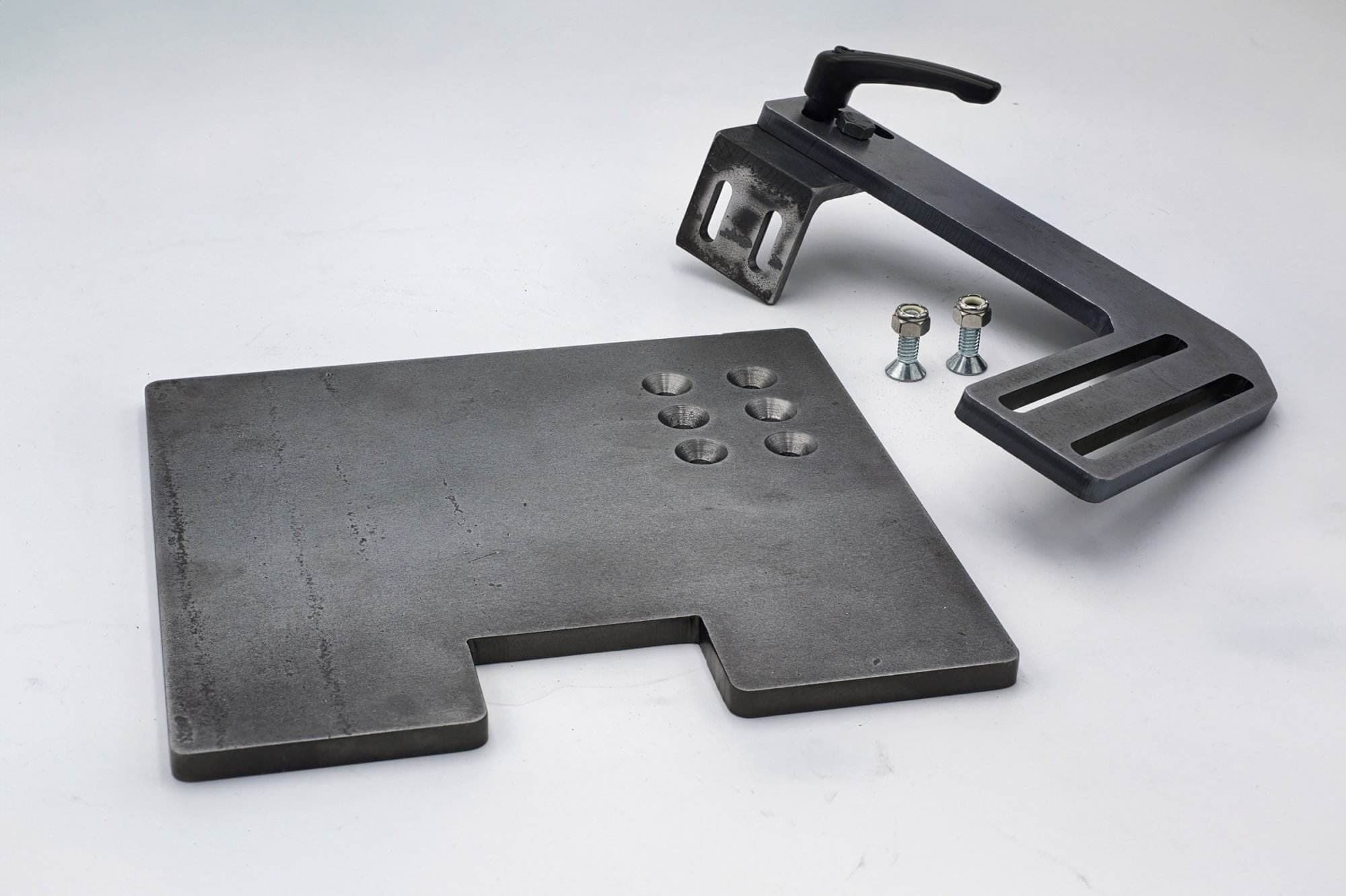 Steel work rest baseplate and adjustable clamp lever arm shown disassembled with hardware