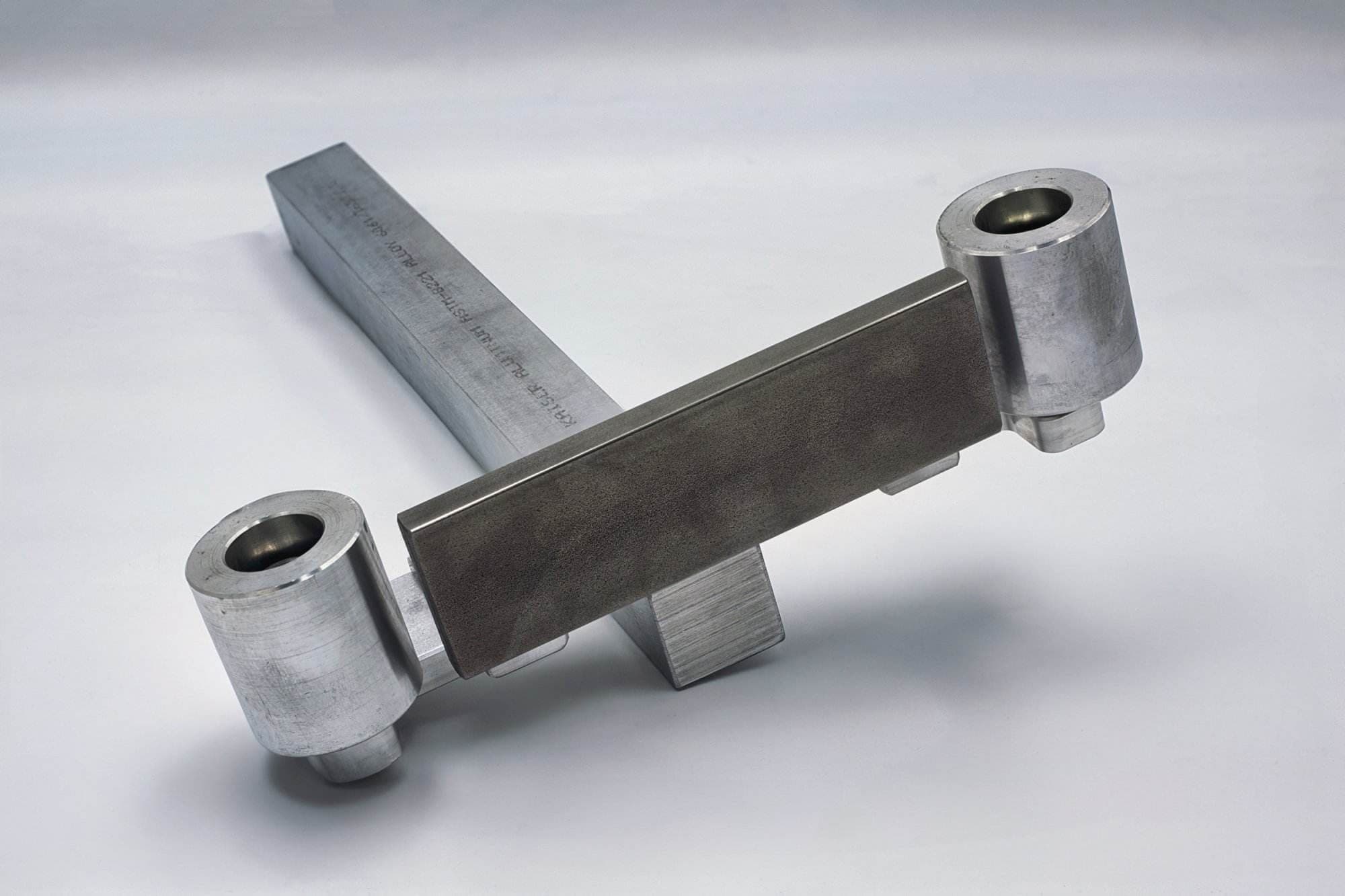 Torus CNC quick-detach work rest arm assembly with dual roller pivots and a machined aluminum body
