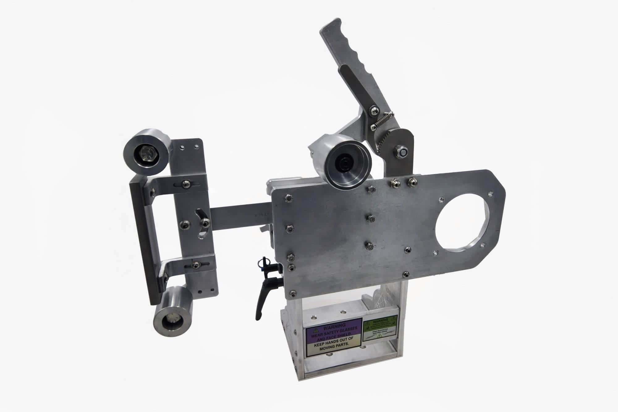 Top wheel cup and quick-release pin lever on a Torus CNC 2x72 grinder tooling arm mount