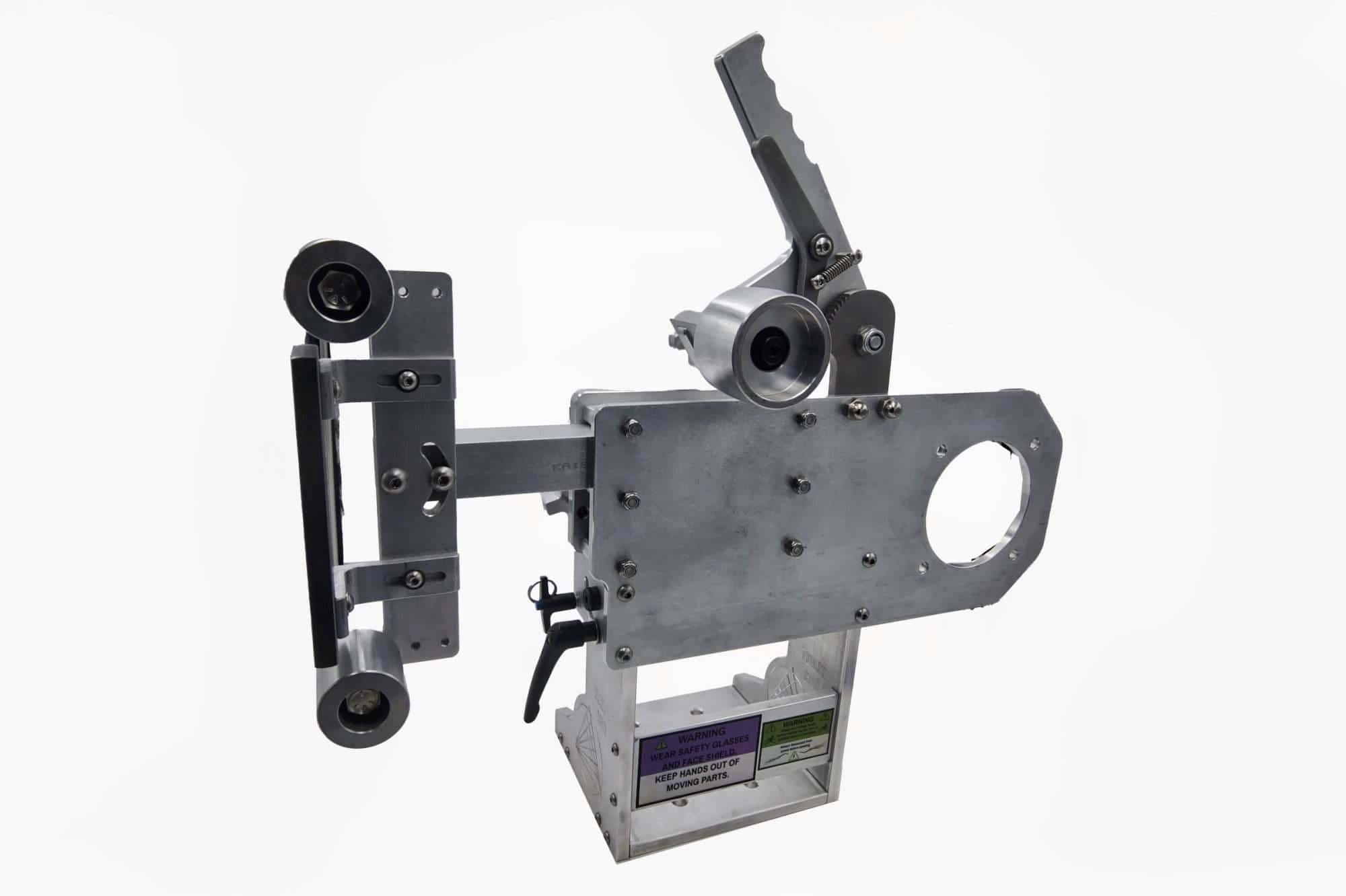 Torus CNC tooling arm with dual tracking wheels and cross-knob tension adjusters mounted upright