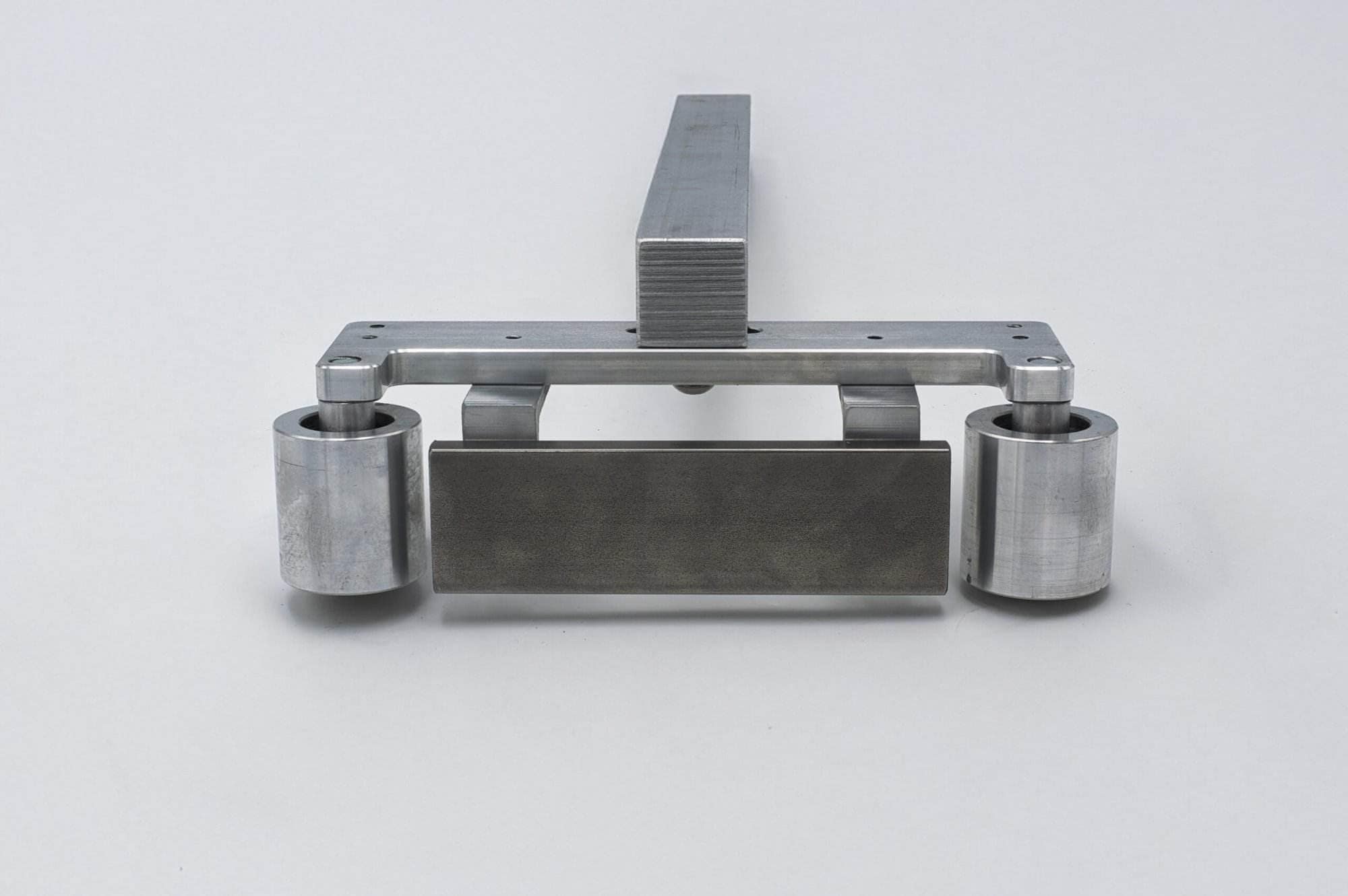 Straight-on view of the Torus CNC quick-detach work rest arm on a white studio background