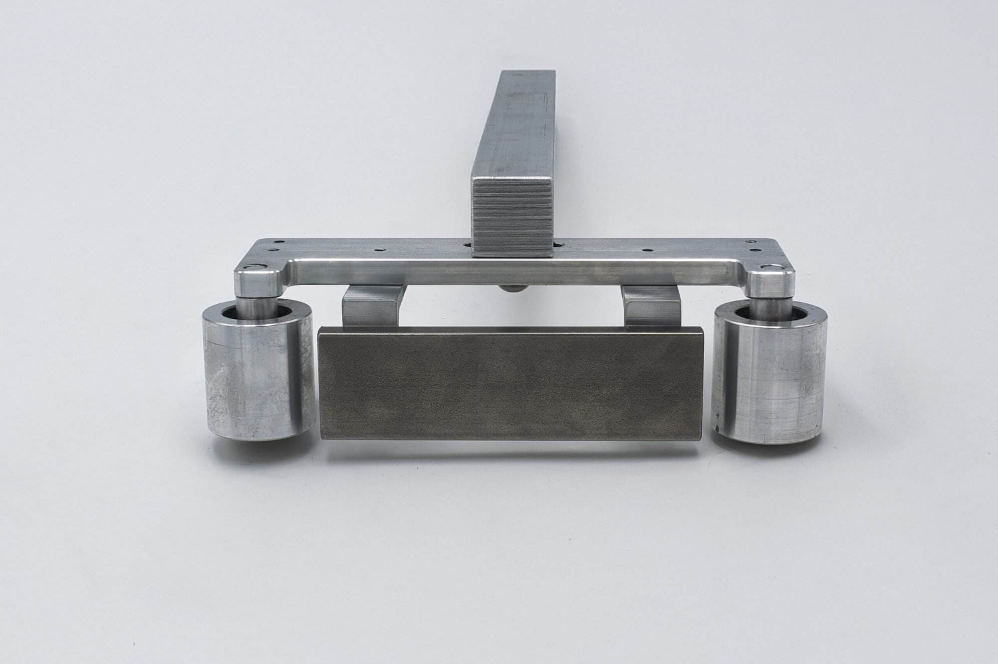 Straight-on view of the Torus CNC quick-detach work rest arm on a white studio background